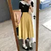 Falda Plisada de Otoño 2026 de Longitud Media Nuevo Estilo Francés de Cintura Alta Adelgazante Chic que Cubre la Cadera para Mujer
