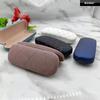 Estojo de óculos de ferro Terceirização de couro Compressão de moda simples Durável Multi-cor Miopia Óculos Caso