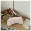 Nova bolsa de axila casual com design de nicho em forma de crescente para comércio exterior, moderna, de alta qualidade, versátil, bolsa de mão feminina para o dia a dia, na moda