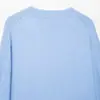 Venta al por mayor de ropa de mujer estilo europeo y americano transfronteriza, suéter de punto suave al tacto con cuello en V, manga larga, elegante y casual 2142192