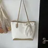 Nova bolsa de ombro/axila de alta costura para o início do outono de 2026, bolsa tote versátil para o dia a dia, bolsa feminina no atacado