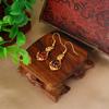 Pendientes largos de latón chapados en oro con micro borlas y esmeralda para mujer, elegantes y atmosféricos, venta al por mayor