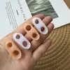 Separador de dedos directo de fábrica para juanete del dedo pequeño corrector de juanete de dedo pequeño juego elástico SEBS para dedo pequeño venta al por mayor