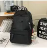 Mochila de viaje versátil estilo coreano para parejas con bordado de letras, mochila escolar elegante y duradera para chicos de secundaria y preparatoria