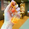 Tendência no TikTok Garrafa de Refrigerante Contas Coloridas Chaveiro Luminoso Preenchido com Óleo Puxador Fácil Lata Areia Líquida Pequeno Pingente Brinquedo Presente Ornamento
