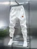 Calça Jogger Masculina Nova e Moderna com Cordão na Cintura Elástica, Calça Esportiva Casual, Calça Versátil de Corte Slim