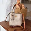 Bolso tipo cubo versátil de alta gama con estampado retro para mujer, modelo nuevo 2026, de alto valor, lujo ligero, para el trabajo, de hombro, cruzado