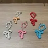 Llavero de arco de arcilla con diamantes completos, colgante de cadena de cuentas de cristal de moda, accesorio de bolso para chica dulce y genial, cadena para colgar el teléfono