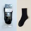 Calcetines de empaque individual para hombre, calcetines de algodón para hombre de color liso para otoño e invierno, calcetines para hombre al por mayor, calcetines deportivos de tubo largo para hombre