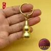 Chaveiro criativo de cabaça oca de latão puro Pingente de carro Chaveiro de pequeno frasco de remédio de emergência Ornaments de armazenamento portátil
