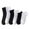 Calcetines de comercio exterior para hombre, calcetines hasta la pantorrilla, calcetines deportivos blancos y negros, medias de color liso, calcetines Zhuji para pareja, calcetines de mujer