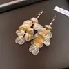 Brincos Vintage com Pétalas Vazadas e Franjas, Nicho de Luxo Leve, Estilo de Ponta, Ganchos Elegantes, Brincos Versáteis de Moda Únicos para Mulheres
