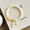 Nuevo brazalete de raíz de bodhi con forma de gato quemado al carbón estilo chino, lindo y de nicho para que jueguen los estudiantes, brazalete decorativo de pata de gato de bodhi para mujeres