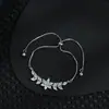 Joyería para mujer de lujo ligero con circonita microincrustada, chapado en oro real, pulsera ajustable de pétalos con cordón para extracción al por mayor