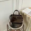 Bolso de mano con acabado mate retro, nueva colección otoño/invierno 2026, bolso cruzado versátil para mujer, bolso tote moderno y popular, bolso de mano pequeño
