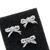 Anillo de Lazo de Diseño Nicho Estilo Coreano para Mujer Simple Lujo Ligero Temperamento Perla con Diamantes Pendientes de Botón Súper Brillantes Dulces