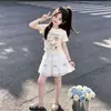 Traje de Moda 2026 Falda Verano Estilo Delgado Dulce y Lindo Dibujos Animados Camiseta de Manga Corta Falda con Lazo Conjunto de Dos Piezas