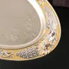 Bandeja metálica ovalada de estilo europeo con motivos florales de colores esmaltados, adecuada para servir fruta, como bandeja de té en hoteles, o para guardar frutos secos.; una pieza decorativa para la decoración del hogar