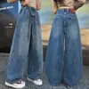 Jeans curvos de ajuste holgado estilo retro americano para niñas, nuevo modelo primavera y otoño 2026, pantalones al por mayor transfronterizos para niños mayores