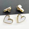Hebilla para camisa en forma de corazón borde dorado punto negro y blanco botón camisa falda suéter moda accesorios de metal botón