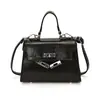 Bolso de mano texturizado de nicho estilo francés 2026 nuevo bolso para mujer, bolso cruzado moderno y simple, bolso cuadrado pequeño popular informal