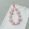 Otoño e Invierno Nuevo Pastel Pintado a Mano Cadena para Teléfono Móvil Colgante Bola de Pelo Cadena de Cuentas Llavero Colgante para Bolso Mismo Estilo de Transmisión en Vivo Cadena Colgante