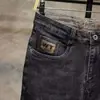 Jeans negros elásticos de primavera para hombre, marca de moda, nuevos pantalones ajustados skinny para primavera y otoño 2006, pantalones largos finos de verano