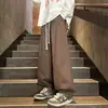 Outono 2026 Novo Calça Casual Masculina Tamanho Grande Estilo Americano Perna Larga Cor Sólida Perna Afunilada Moda Versátil Calça Casual