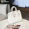 Bolso de Platino con Patrón de Lichi Bolso de Mano de Cuero Genuino Gran Capacidad Bolso Tipo Kelly para Mujer 2026 Nuevo Bolso de Hombro de Moda Tendencia