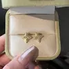 Recomendado en Xiaohongshu Douyin Taobao Transmisión en Vivo Popular Mismo Estilo que Xiaoxiang Pendientes de Estrella de Cuatro Puntas Incrustados de Diamantes Pendientes para Mujer