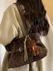 Bolso tote de lunares de nicho de estilo coreano muy elegante, nuevo modelo otoño 2026, bolso de hombro casual de gran capacidad para el trabajo y los desplazamientos