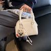 Bolso de mano de alta gama para mujer, primavera y verano 2025, nuevo, sencillo, para ir al trabajo, bandolera de hombro, bolso informal coreano con forma de concha