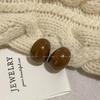 Aretes retro Maillard semicírculo resina temperamento femenino nicho diseño sentido aretes otoño e invierno moda estilo frío aretes