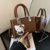 Bolso cuadrado pequeño moderno y elegante 2026 Otoño Nuevo Casual Nicho Personalidad Estilo Coreano Personalidad Color Sólido Bolso de Hombro Único Cruzado
