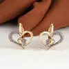 Pendientes de huella de pie pequeña con forma de corazón hueco, superventas transfronterizos, pendientes para mujer con diseño de huella de corazón incrustado de diamantes