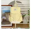 Mochila de nailon de lunares de gran capacidad estilo coreano para mujer, nueva de 2026, mochila pequeña casual de viaje con ribete de encaje