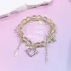 Pulsera de cristal de color degradado de 10 mm para mujer, accesorio dulce y versátil para estudiantes, alas de corazón, pulsera de cristal de flor de cinco pétalos