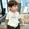 Camiseta de manga larga para niño, nuevo modelo primavera y otoño 2026, camiseta básica holgada para niños, top a rayas para niños, otoño