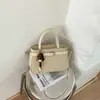 Bolsa de ombro e transversal vintage versátil em blocos de cor, bolsa quadrada pequena de grande capacidade para o dia a dia, bolsa de mão de moda minimalista de nicho, bolsa Kelly