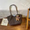 Bolsa Tote Retrô Feminina 2026 Nova Textura Fashionável Nicho Para o Dia a Dia Cesta de Compras Tecida de Mão Bolsa de Ombro