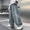 Jeans rasgados para niños con rayas laterales, Nueva colección de primavera 2026 para niños mayores, Pantalones holgados de pierna recta, Tendencia de venta al por mayor transfronteriza