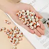 Joyería de cerámica rosa cuentas sueltas paquete de material tejido a mano para bricolaje accesorios de producción para estudiantes niños cuentas de canasta de flores de agujero grande