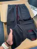 Calça casual de blocos de cor texturizada estilo americano para homens, fina para o outono, com múltiplos bolsos, respirável, perna reta, solta, perna larga