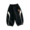 Pantalones deportivos infantiles de estilo europeo y americano, versión coreana, diseño color block, pantalones deportivos casuales para primavera y otoño, con puños elásticos