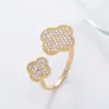 Anel de quatro folhas personalizado estilo coreano transfronteiriço com diamante design geométrico simples nicho anel de metal à vista