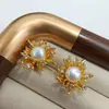 Moda de Año Nuevo 2026 Estilo de Alta Gama Fuegos Artificiales Floreciendo Pendientes de Perla Natural para Mujer, Simples, Ligeros, Lujosos y Elegantes