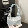 Bolso de lunares de nicho súper popular para mujer, nuevo bolso de moda 2026 versátil para hombro y axila, bolso de mano pequeño exquisito