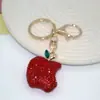 Venta al por mayor del fabricante Llavero de Manzana de Arcilla Blanda con Diamantes, Lindo Colgante Personalizado para Bolso, Llavero de Coche, Accesorios Coloridos
