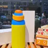 Nueva botella de agua térmica estilo macarrón de comercio exterior, hecha de acero inoxidable 304, con tapa abatible portátil, adecuada para hombres, mujeres y estudiantes; una botella de agua linda