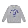 Marca moderna de estilo japonês com estampa de desenho animado de cabeça de macaco, nova blusa de moletom casual de gola redonda em terry de corte solto para homens e mulheres, adequada para adolescentes no outono e inverno